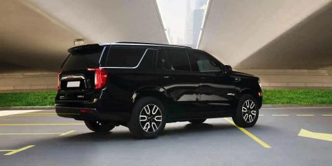 GMC Yukon Denali at4 for rent in Dubai, bold black SUV, powerful SUV, full comprehensive insurance, no deposit